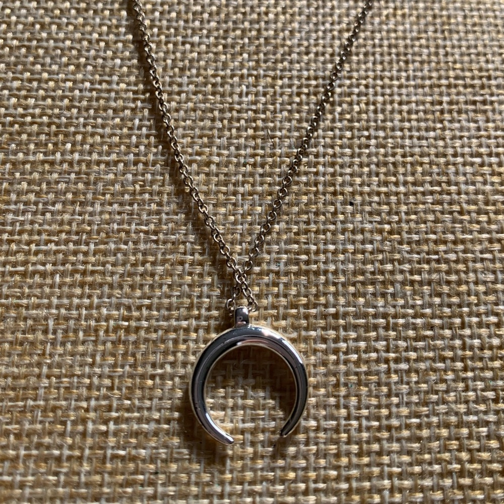 Tiny horn or moon symbol pendant. Silver plated necklace